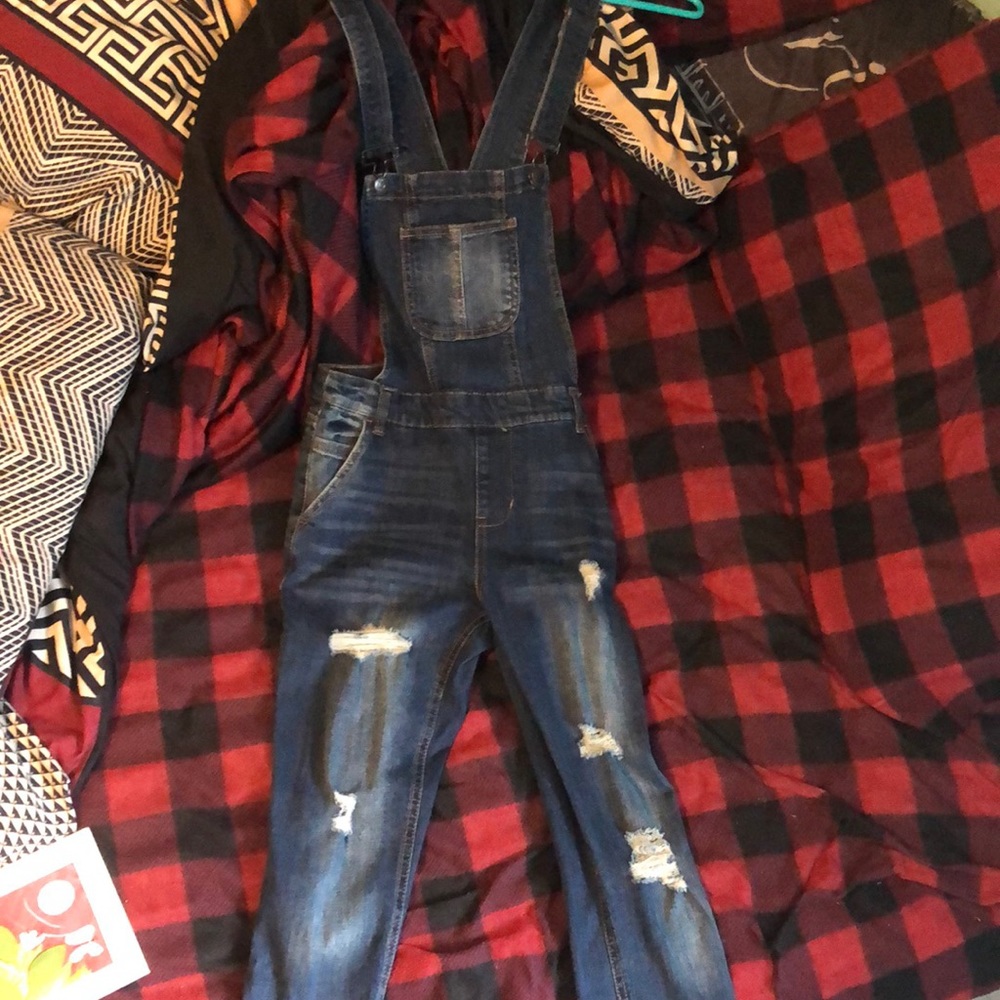 Ripped jean overalls